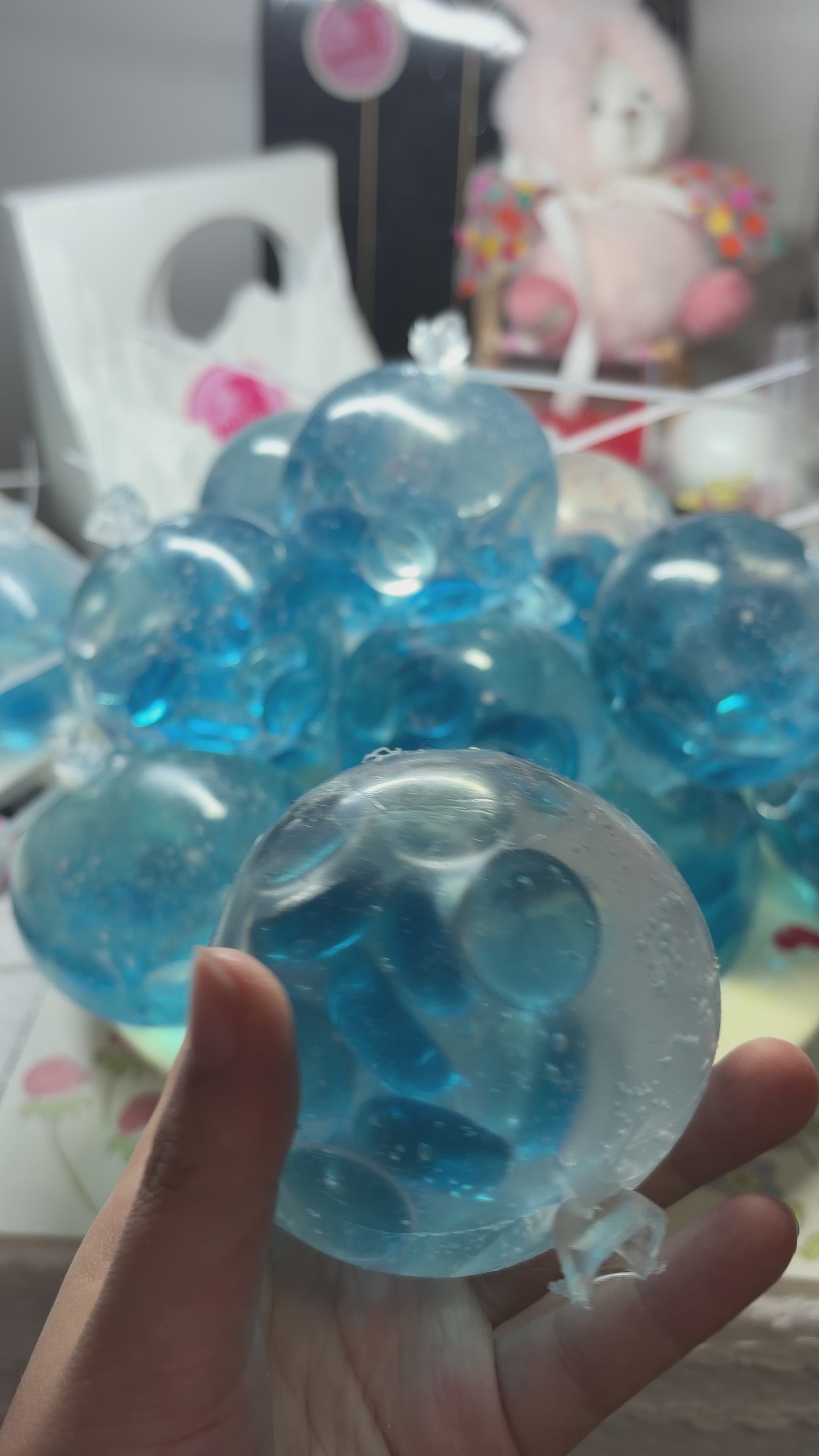 Crystal‑clear handmade squishy packed with shiny aqua flat pebbles. Squeeze and shake with medium force for loud energetic pebble‑collision noise, viral aesthetic stress relief fidget toy.