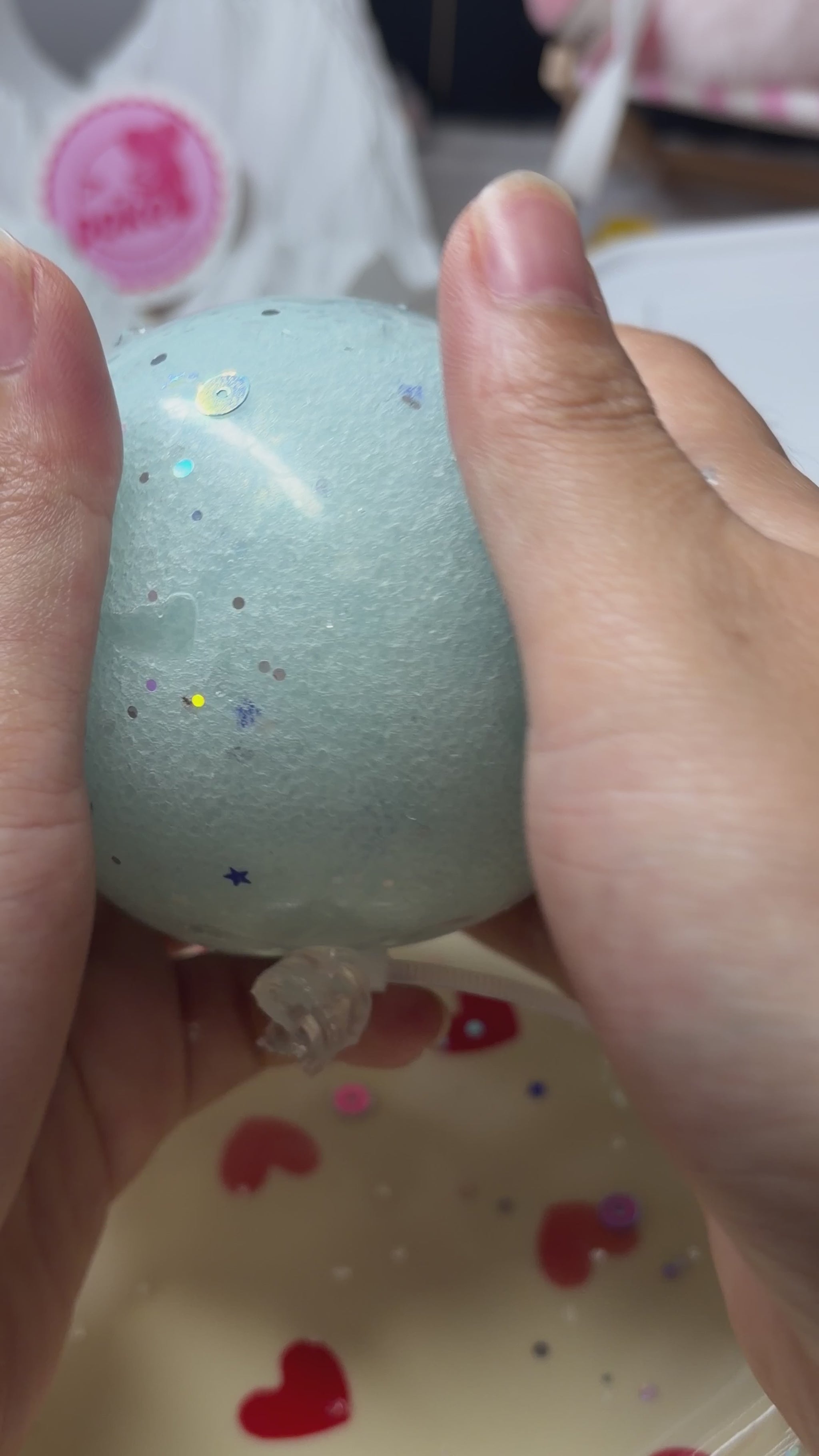 Frosty light‑blue handmade squishy ball with holographic star and dot sequins. Soft light‑force icy‑sand texture, calming ASMR crunch sound, viral aesthetic stress fidget toy.
