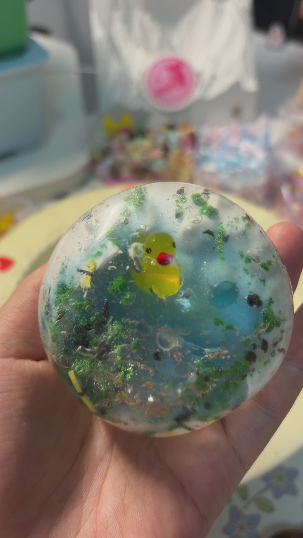 Gradient lake‑blue handmade crispy squishy with a tiny yellow duck, grass and stone decorations. Medium squeeze creates addictive crunchy ASMR noise, viral aesthetic stress fidget toy.