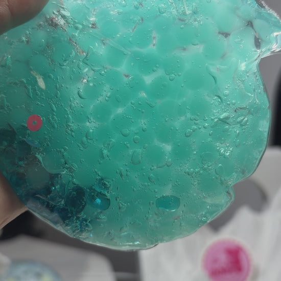 Handmade transparent mint‑blue squishy pouch. Light‑blue beads can be crushed with medium squeeze. Enjoy satisfying popping ASMR sounds, viral stress relief fidget toy.