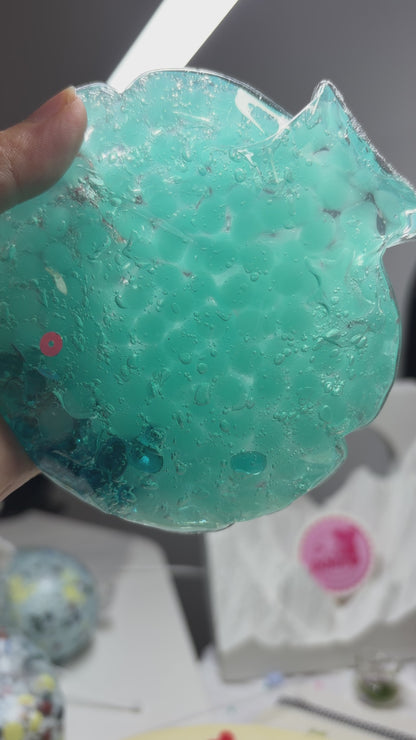 Handmade transparent mint‑blue squishy pouch. Light‑blue beads can be crushed with medium squeeze. Enjoy satisfying popping ASMR sounds, viral stress relief fidget toy.